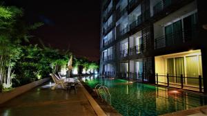 Bazén v ubytování Retreat Resort Pattaya nebo v jeho okolí