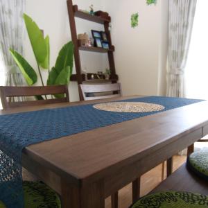 a wooden table with a blue table cloth on it at Alaha Blue Resort 6F -SEVEN Hotels and Resorts- in Chatan