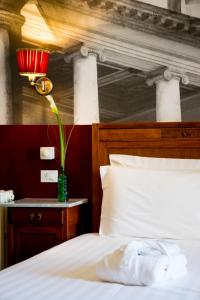 Säng eller sängar i ett rum på Antico Hotel Vicenza