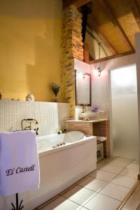 a large bathroom with a tub and a sink at Valterra y Tosal in Torres-Torres