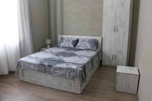 Postel nebo postele na pokoji v ubytování Guest House Lviv Грузия