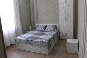 Postel nebo postele na pokoji v ubytování Guest House Lviv Грузия