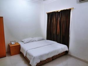 Letto o letti in una camera di Plaza Hotel