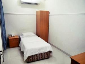 Letto o letti in una camera di Plaza Hotel