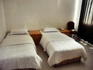 Letto o letti in una camera di Plaza Hotel