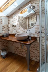 a bathroom with a sink and a mirror at A Esmorga-Posada del Mar in Vilagarcia de Arousa +62 photos