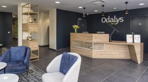 a lobby of an office with chairs and a counter at Appart'hôtel Odalys City - Le Mans Centre Palais des Congrès in Le Mans +16 photos