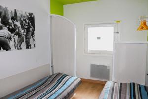 Katil atau katil-katil dalam bilik di Hoteleco Sud Agen Autoroute