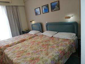 Postel nebo postele na pokoji v ubytování Amvrakia Hotel