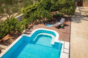 an overhead view of a swimming pool in a backyard at Villa Didovi dvori in Marina