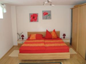 מיטה או מיטות בחדר ב-Ferienwohnung Weiser