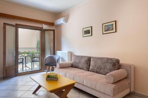 a living room with a couch and a table at Katerina's Cozy Mountain View Apartment in Argostoli