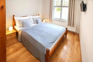 Posteľ alebo postele v izbe v ubytovaní Hotel Zámeček Janovičky