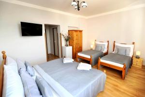 Posteľ alebo postele v izbe v ubytovaní Hotel Zámeček Janovičky