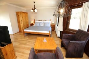 Posteľ alebo postele v izbe v ubytovaní Hotel Zámeček Janovičky