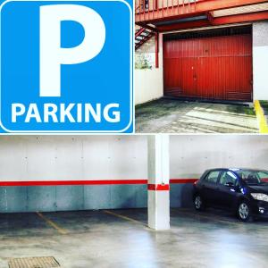 a parking sign and a car parked in a parking lot at Hotel Humanes in Humanes de Madrid