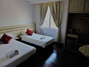 Katil atau katil-katil dalam bilik di The Blanket Hotel Seberang Jaya