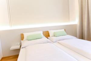 
Ein Bett oder Betten in einem Zimmer der Unterkunft Vino Verde
