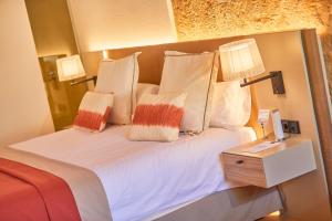 Postel nebo postele na pokoji v ubytování Santa Clara Urban Hotel & Spa