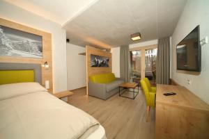 Телевизор и/или развлекательный центр в Appartementhaus Burgfried