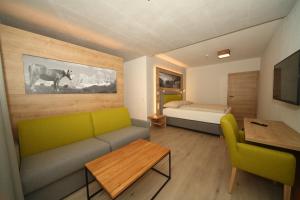 Кровать или кровати в номере Appartementhaus Burgfried