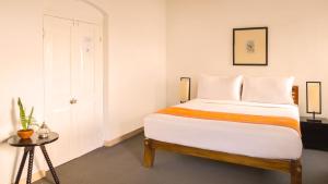 Posteľ alebo postele v izbe v ubytovaní The Cottage by Jetwing