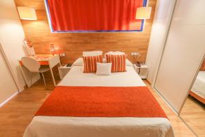 Una cama o camas en una habitación de Hotel Fetiche Alojamiento con Encanto