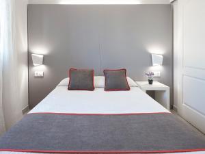 Postel nebo postele na pokoji v ubytování Hostal Mas Ferrer
