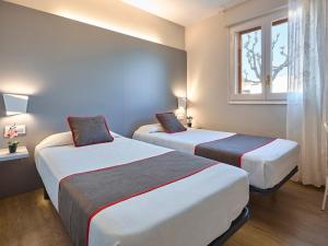 Postel nebo postele na pokoji v ubytování Hostal Mas Ferrer