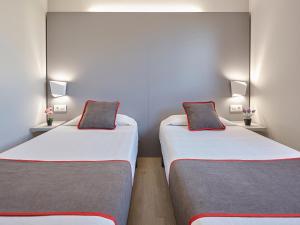 Postel nebo postele na pokoji v ubytování Hostal Mas Ferrer