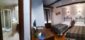 
Cama o camas de una habitación en Hostal Rio Almar
