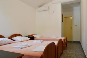 Postel nebo postele na pokoji v ubytování Apartments Stanka