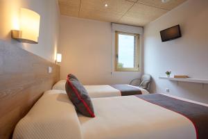 Cama o camas de una habitación en Hostal Nobadis