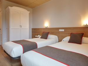 Cama o camas de una habitación en Hostal Nobadis