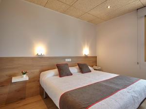 Cama o camas de una habitación en Hostal Nobadis
