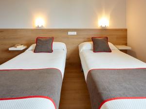 Cama o camas de una habitación en Hostal Nobadis