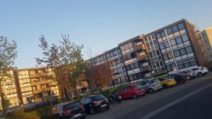 a row of cars parked in front of a building at myHome in Gießen