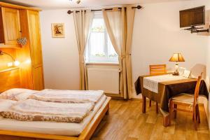 Ένα ή περισσότερα κρεβάτια σε δωμάτιο στο Sylvie Fahrer et Fils