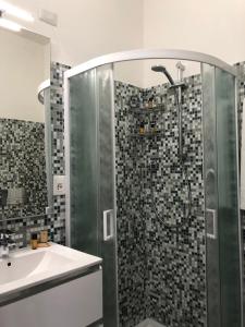 a bathroom with a shower and a sink at Carpe Diem in Olbia