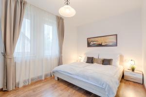 Posteľ alebo postele v izbe v ubytovaní Fortuna 7 Apartments
