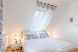 Posteľ alebo postele v izbe v ubytovaní Fortuna 7 Apartments