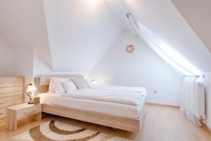 Posteľ alebo postele v izbe v ubytovaní Fortuna 7 Apartments