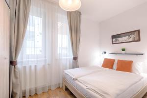Posteľ alebo postele v izbe v ubytovaní Fortuna 7 Apartments