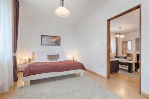 Posteľ alebo postele v izbe v ubytovaní Fortuna 7 Apartments