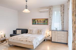 Posteľ alebo postele v izbe v ubytovaní Fortuna 7 Apartments