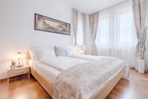 Posteľ alebo postele v izbe v ubytovaní Fortuna 7 Apartments