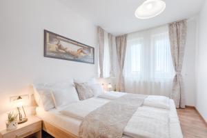 Posteľ alebo postele v izbe v ubytovaní Fortuna 7 Apartments