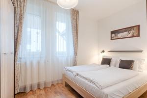 Posteľ alebo postele v izbe v ubytovaní Fortuna 7 Apartments
