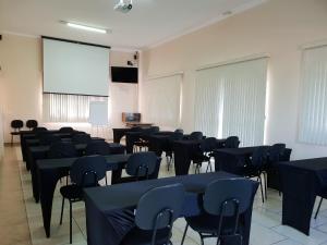a room with tables and chairs and a screen at Hotel ITR-SPA in Itupeva +38 photos