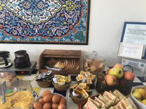 a table topped with baskets of food on a counter at Il Miraggio in Fregene
